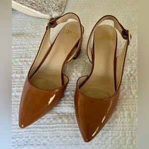 Jones New York dress pump sling back with an ornamental charm on the buckle.